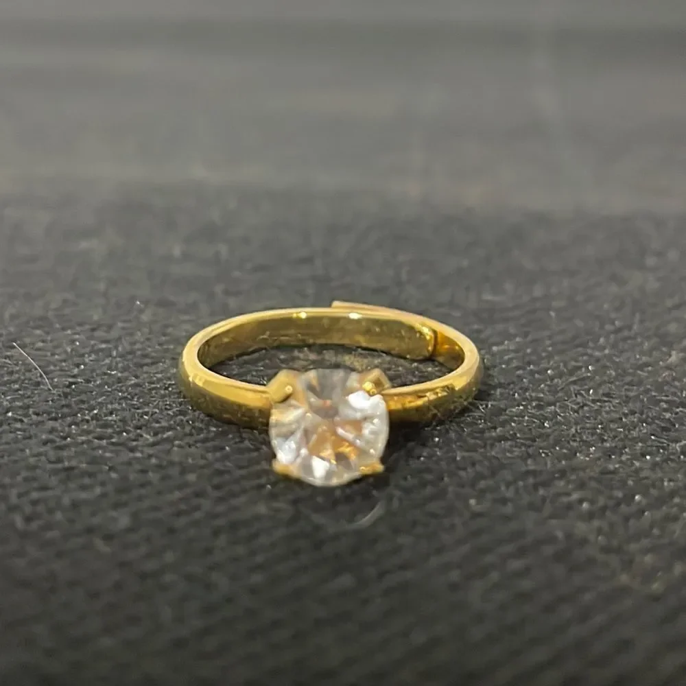 Adjustable band ring with a white gem